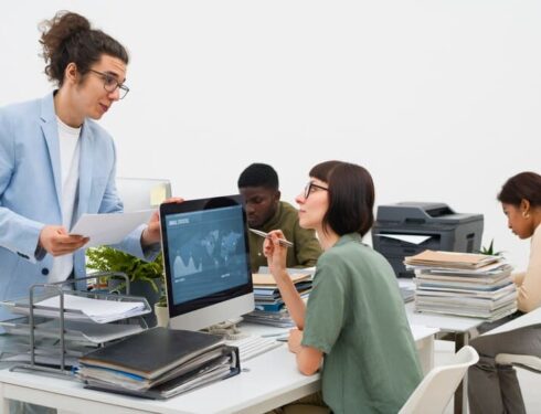 Colleagues Speaking in Office